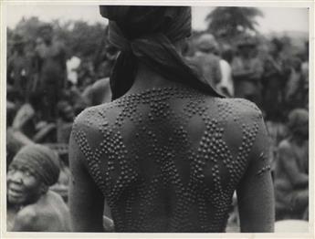 (AFRICA--PHOTOJOURNALISM) Group of 12 prints depicting native peoples with elaborate scarification (cicatrice) patterns, large lip pl